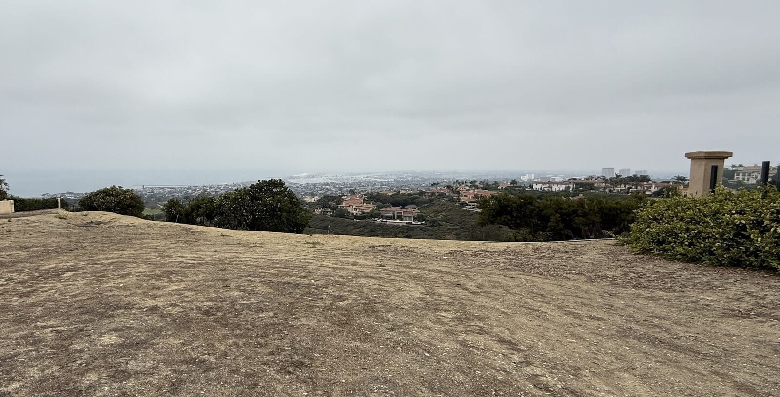 Unaltered August 2025 photograph of the vacant Pelican Crest site before closing